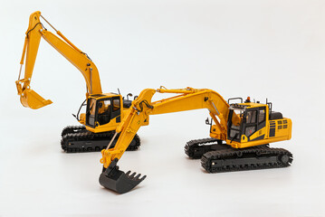 Two yellow excavator   model   on  a white background