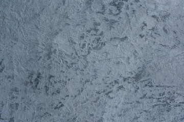 Grey abstract acrylic background. Texture imitation of a dark gray concrete surface. Rough cold background with streaks of brush movement.Empty layout for design, postcards, banners with space to copy