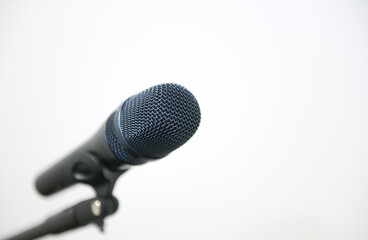 Close up view of a sound microphone against white background