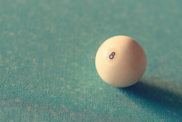 billiard ball on green cloth