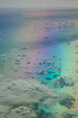 Aerial view of the Tyrrhenian sea. Colors produced when light is passed through the airplane window.