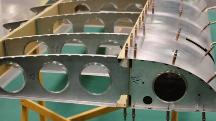 Demonstration of the aircraft wing structure. Sectional plane wing. Front, rear spar, rib, flap, slat and other wing elements. Closeup view