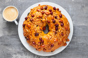 typical portuguese fruit cake Bolo rainha on white dish