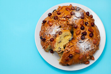 typical portuguese fruit cake Bolo rainha on white dish