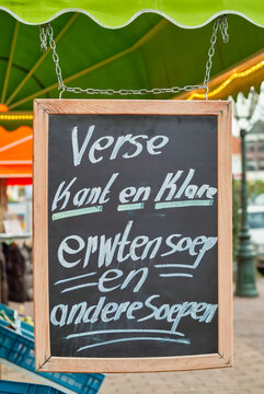 Grocery chalkboard advertisement with the Dutch text 'Fresh ready to go pea soup and other soups'