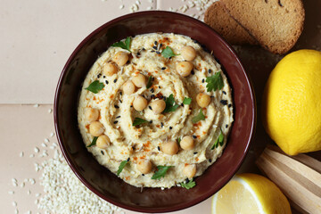Hummus - chickpea traditional jewish and lebanese cuisine dish, flat lay, from above overhead top...