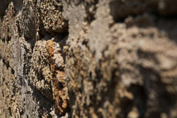 Fragment of old stone wall in defocused. Design elements