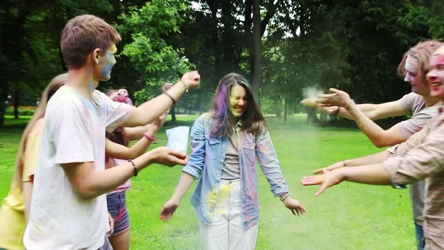 group of friends having fun at holi festival