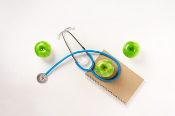 Apples and stethoscope medical as a health concept. White background, space for text.