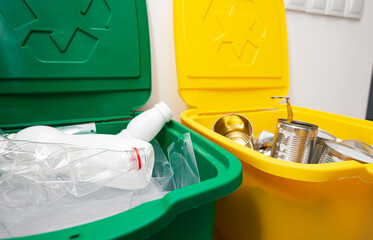 Two full trash cans for sorting garbage. For plastic and cans