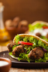 Kebab, kofta in pita, bun. Traditional southern European dish. Front view.