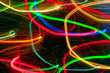 Abstract light trails on dark background.