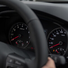 Speedometer in the car on the dashboard at night. Selective focus