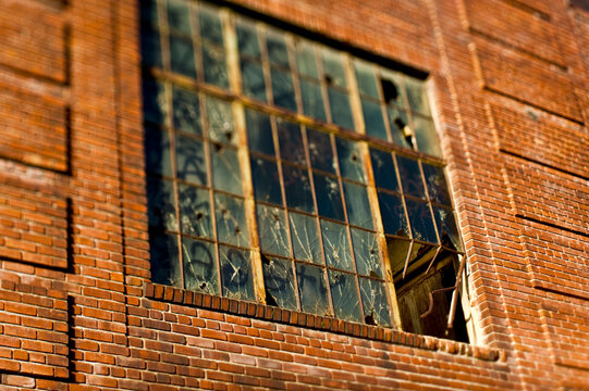 Broken window in old warehouse.
