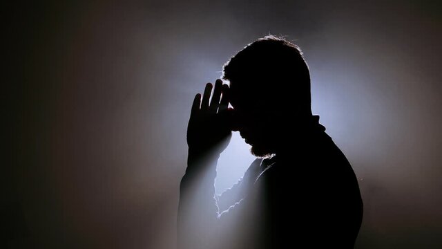 Young male praying