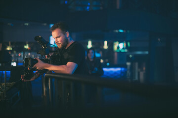 Director of photography with a camera in his hands on the set