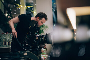 Director of photography with a camera in his hands on the set.