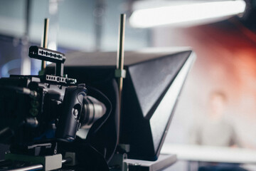 Professional film and video camera on the set. Shooting shift, equipment and group.