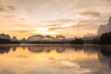 Ban Nong Thale the natural scenery of the sunshine in the morning (mountains, lakes, trees, fog) at Thailand.