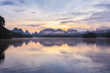 Ban Nong Thale the natural scenery of the sunshine in the morning (mountains, lakes, trees, fog) at Thailand.