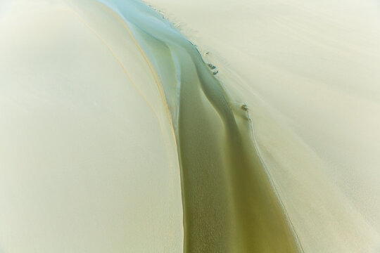 Sand and water patterns, estuary, Manche, Normandy, France
