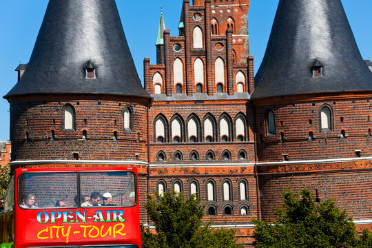 The Holstein Gate & open air tour bus in the Hanseatic city of Lubeck