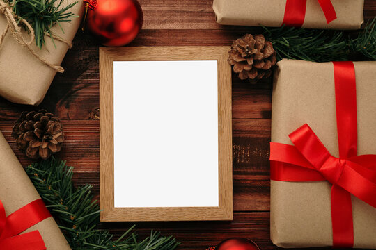 Merry christmas photo frame mockup template with christmas gifts decorations.