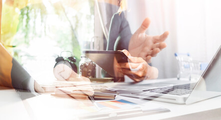 Businesswomen hands working with finances about cost and calculator and laptop with tablet, smartphone at office in morning light