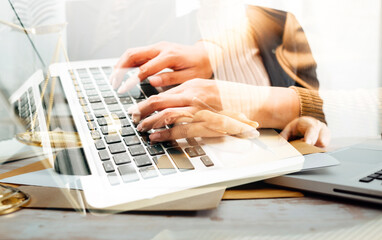 Business and lawyers discussing contract papers with brass scale on desk in office. Law, legal services, advice, justice and law concept