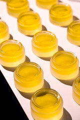 CBD Balm and cosmetic jars. Handmade cosmetics. Skincare products being made.