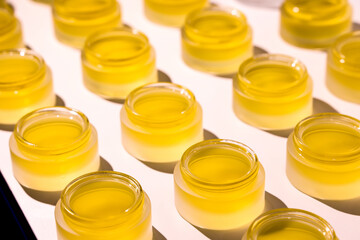 CBD Balm and cosmetic jars. Handmade cosmetics. Skincare products being made.