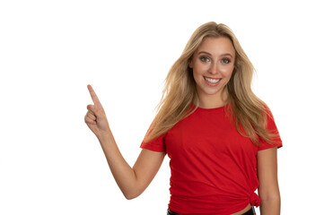 Beautiful young woman in red tshirt point in copy space