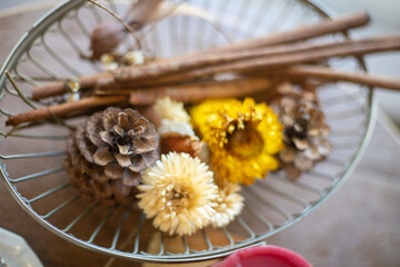 Flowers and cinnamon on the plate
