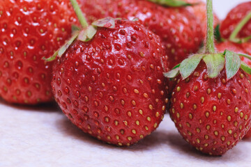 Fresh ripe strawberries on white . Close-up. Macro.