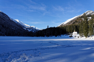Fototapeta na wymiar a small church in the snowy mountains