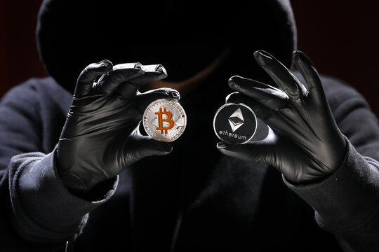 International hacker is trying to steel your crypto currencys. Blockchain security. Thief with laptop is hacking governments computers. Phishing attacks. 