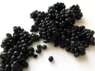  Caviar on white background.    Caviar on white plate.   