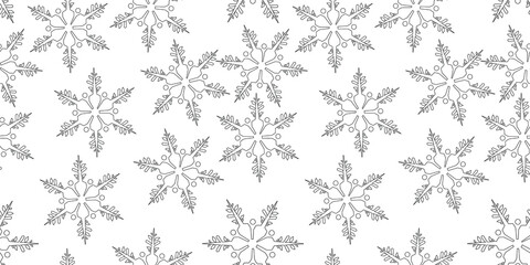 Vector seamless texture. Pattern of snowflakes with different ornaments.
