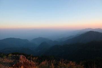 Fototapeta na wymiar Sunset on mountains panoramic view in nature wallpaper background