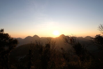 Sunset on mountains panoramic view in nature wallpaper background