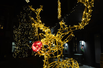 Christmas decoration in Vilnius, Lithuania, lights and night background with Rudolph the Red-Nosed...