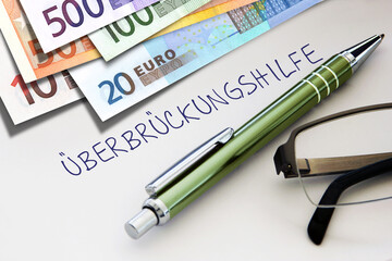 ÜBERBRÜCKUNGSHILFE