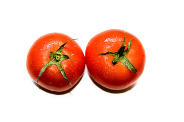 Ripe red tomato on white background