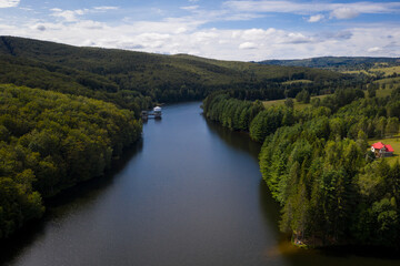 Fototapeta premium Drone photograph of Trei Ape mountain lake in Semenic mountains, Romania