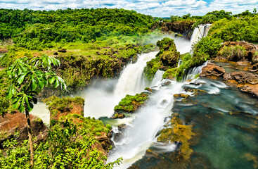Naklejka na ściany i meble Iguazu Falls in a tropical rainforest. UNESCO world heritage in Brazil and Argentina