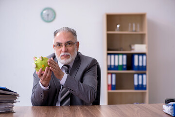 Old male employee in budget planning concept