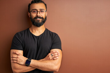 confident concentrated arabic male posing isolated in studio, indian arabian modern man smiling