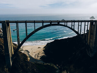 Suspension bridge near waving ocean