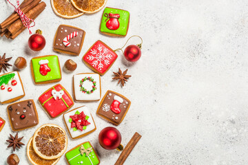 Christmas gingerbread cookies with holidays decorations. Creative handmade present for christmas holidays. Top view image.