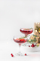 Winter drink cocktail cranberry rosemary white background.